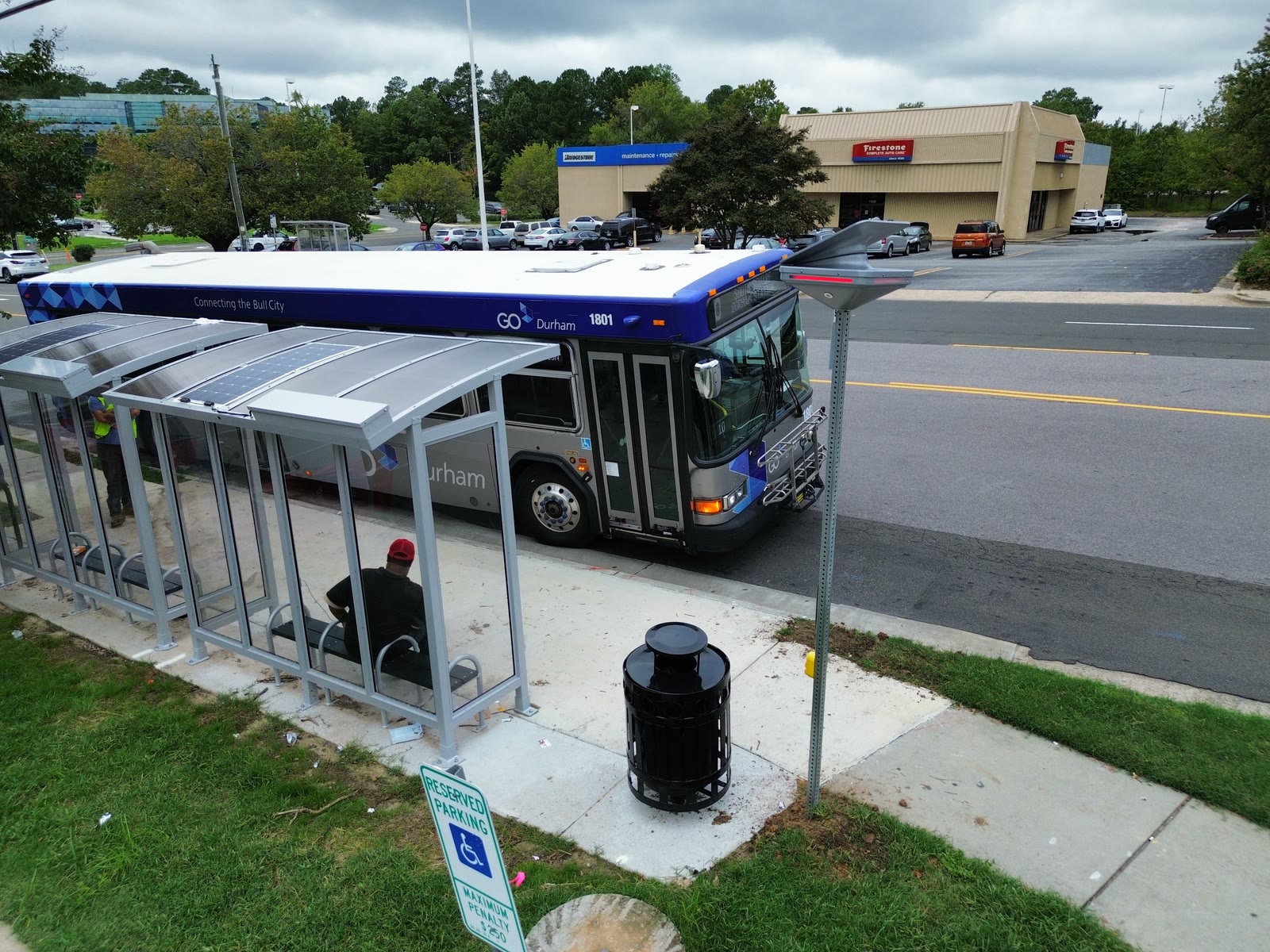 Solar passenger infrastructure beside an active public transit route